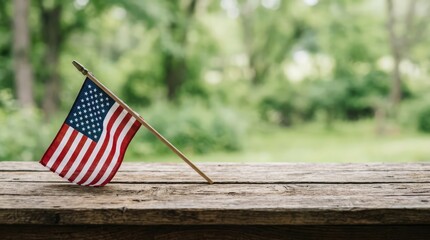 American flag on a rustic wooden table in a green park setting