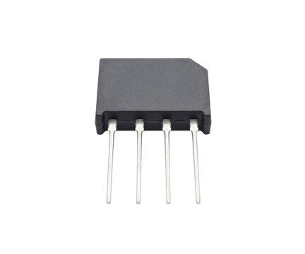 Black bridge rectifier component with four silver pins isolated on grey background studio shot.