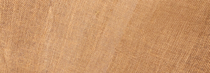 Fototapeta premium Brown sackcloth jute background.