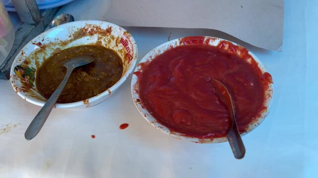 Traditional Indonesian spicy chili sauce and savory peanut sauce as a complement