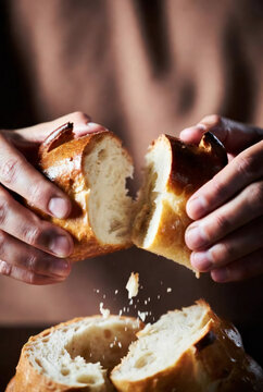Original name(s): Close-up of hands breaking bread, warm tones, sensory food experience, soft light