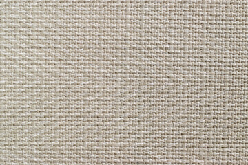 Fototapeta premium Close up of beige synthetic leather texture with woven pattern background. Premium faux leather upholstery material for furniture or fashion design.