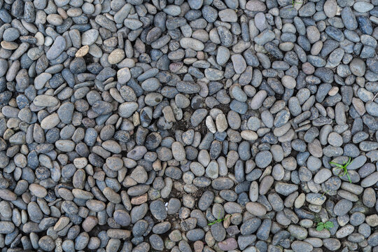 Small pebbles beach or river stones. Seamless texture background. Graphic resource material