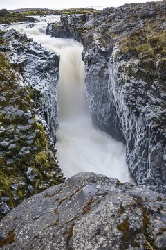 Rushing stream plunges into a narrow gorge, Fjallabak Nature Reserve, Sudurland, Iceland