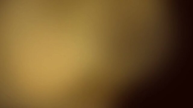 Warm golden brown gradient background featuring soft radiant illumination and smooth tonal transitions. Elegant motion design with subtle depth, rich textures, and atmospheric visual warmth.