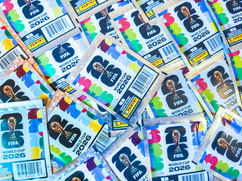 Calgary, Alberta, Canada. June 6, 2026. Top-down view of a scattered pile of official Panini FIFA World Cup 2026 foil sticker packs.
