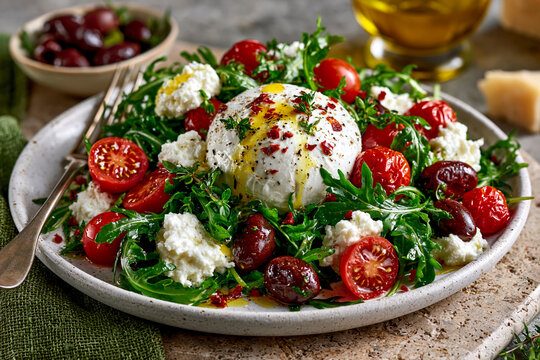 Burrata mozzarella cheese salade with tomato and olive