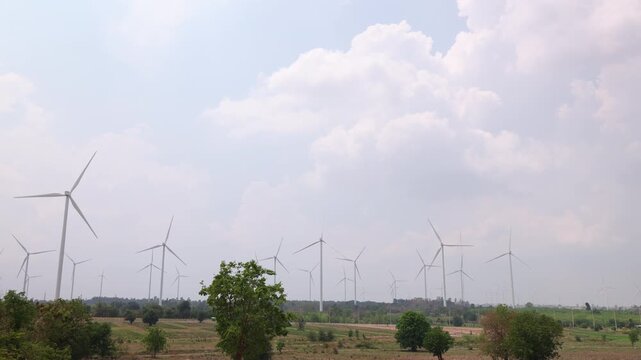 Large Wind Turbine Farm Operating In Open Agricultural Landscape For Sustainable Renewable Energy Generation
