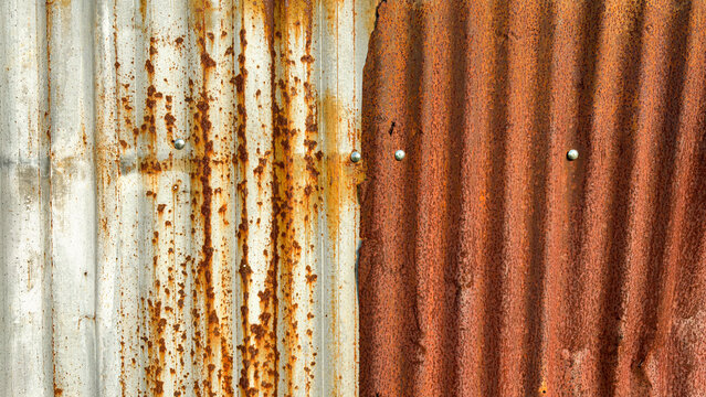 Rusted corrugated iron sheet texture with galvanized zinc wall
