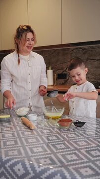 Mother and son bonding over cooking in the kitchen