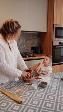 Mother and son bonding over dough preparation