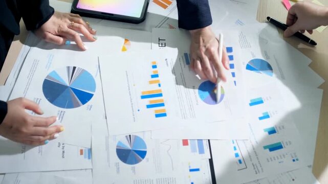 Stock footage of professional team analyzing financial report
