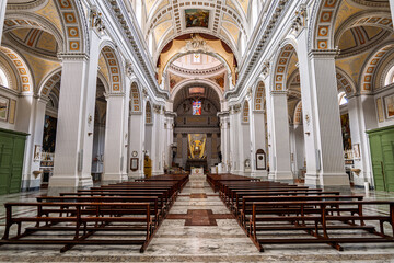 Naklejka premium Interior of ornate baroque cathedral with colonnaded nave and gilded altar, Caltagirone, Sicily