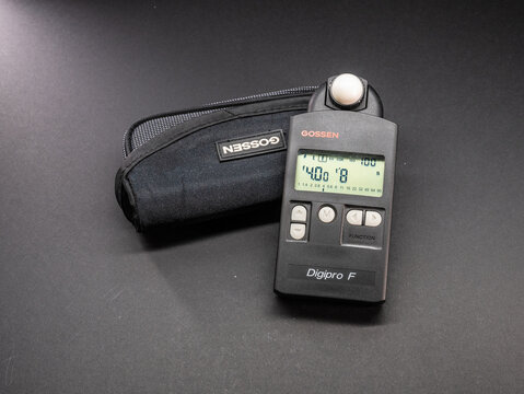 Gothenburg, Sweden - October 15 2023: Gossen Digipro F digital light meter with soft case on dark tabletop.