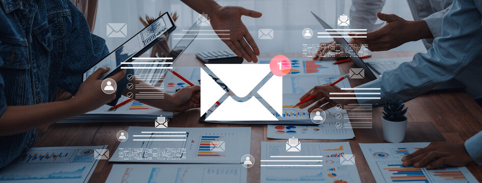 A dynamic team collaborates in an office setting, utilizing digital devices and data analysis. The fusion of technology and teamwork enhances productivity and communication. Cyphers