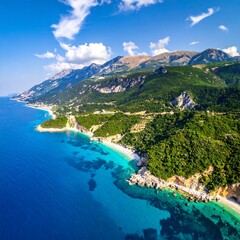 Obraz premium Aerial view of a stunning coastline with turquoise waters and mountains