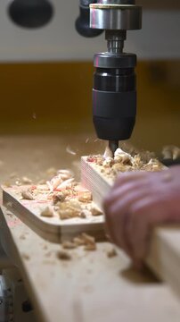 Joiner Operating Drill Press Skillfully. Woodworker Carefully Drilling Panels In Wellequipped Shop Space. Media