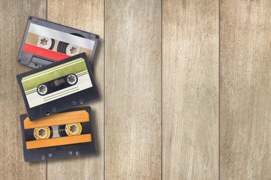 audio cassettes on wooden background