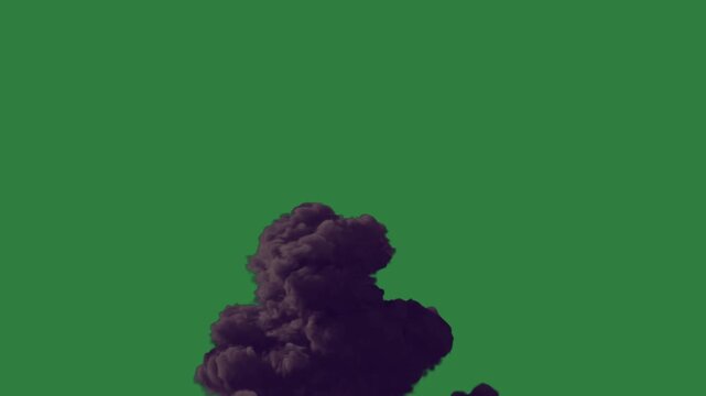 Man in suit pumpkin on is sitting the floor front fire burns bunch flowers middle pile black smoke cloud explosion