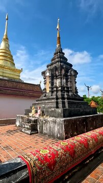 Wat Phra That Chang Kham Worawihan .The temple is located in the heart of Nan Thailand . Inside the chapel, the atmosphere is quiet and magical : Pan left Footage