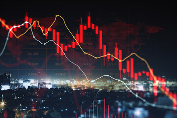 Fototapeta premium Stock market decline chart with red candlesticks and trend lines over illuminated city background depicting global financial downturn concept.