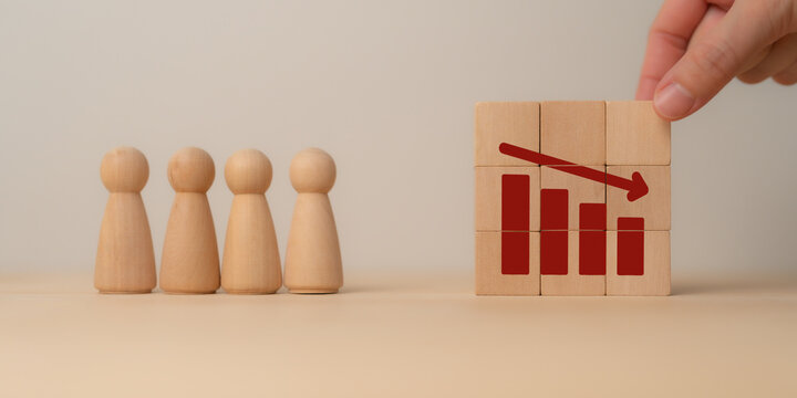 AI Workforce Displacement and Employment Transformation. Wooden figures face a declining workforce chart. AI-driven automation, job displacement, labor shifts, and economic transformation.