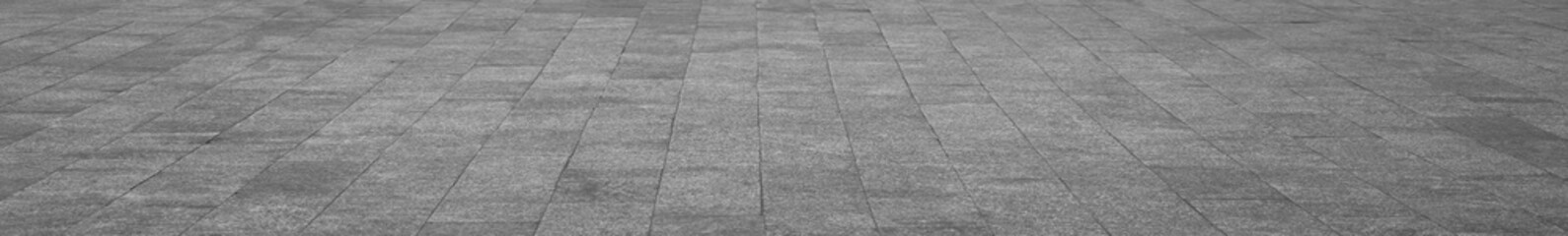 Obraz premium empty stone floor top in perspective. grey tile floor background in perspective view. line. empty copy space stone street. pavement. Granite outdoor tiled floor. gray granite. Marble texture