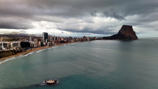 Aerial view of Calpe coastline, city beach and Penon de Ifach, Spain