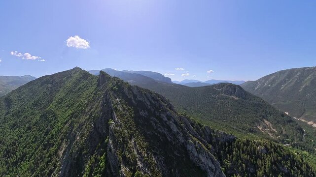 scenic  aerial footage pilot POV of french alps in Provence under blue sly and nice white clouds 