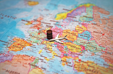 Naklejka premium Airplane and fuel barrel on a map of Europe.