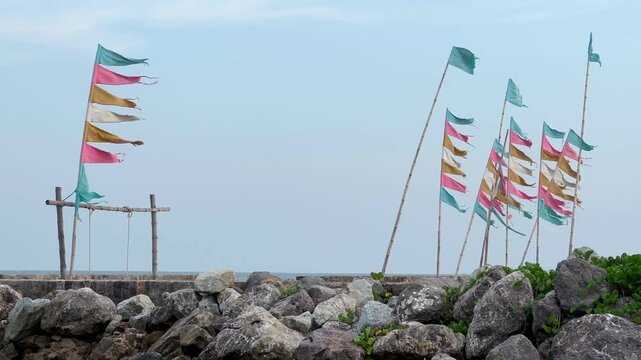 Colorful flags at the beach in windy day