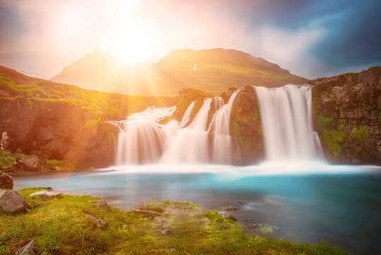 View to the Kirkjufell waterfall at summer. Kirkjufellsfoss waterfall, Iceland, Europe.