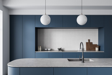 Obraz premium Modern minimalist kitchen interior with blue cabinetry, tiled backsplash, island countertop and pendant lighting captured in clean style. 3D Rendering