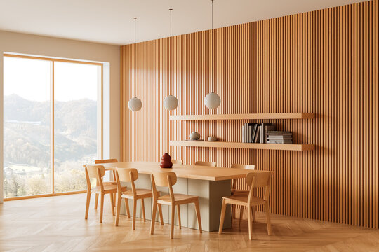 Warm minimalist interior dining room with wooden table, chairs, slatted wood wall panels, pendant lights and large window overlooking a serene landscape. 3D Rendering