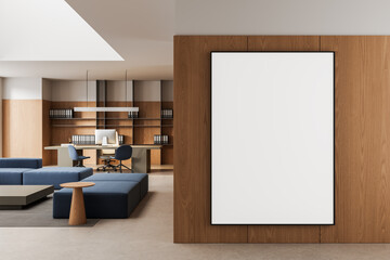 Naklejka na ściany i meble Large empty poster mockup on wooden wall in modern office interior with seating area and workspace in contemporary design. 3D Rendering