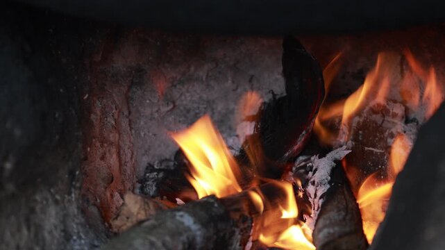 Wood burning in a traditional clay oven
