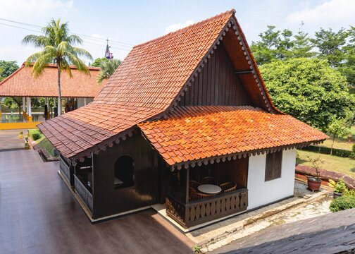 Traditional Betawi Rumah Kebaya featuring its distinctive folded roof design, showcasing authentic Indonesian vernacular architecture and cultural heritage in Jakarta.