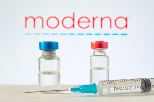 glass ampoule with a clear liquid on a blue background with the logo of a pharmaceutical company moderna