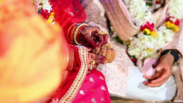 Bride and Groom Hands During Traditional Hindu Wedding Ceremony Performing Sacred Marriage Rituals in India. Ideal for wedding, relationship, religion, family, celebration, and Indian cultural themes.