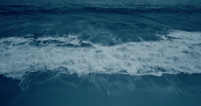 Night tropical sea waves on the beach