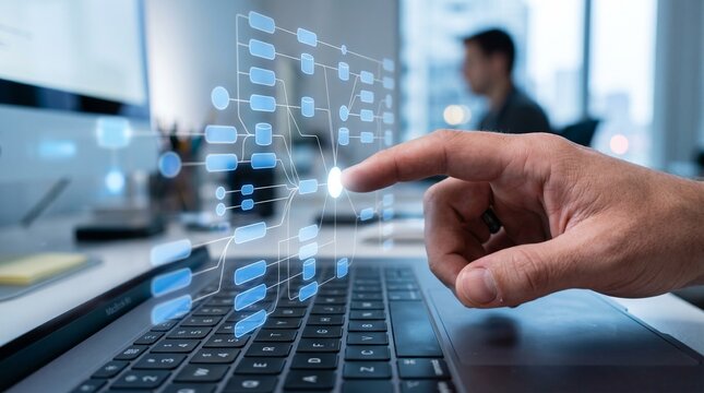 Hand touching virtual flowchart interface over laptop keyboard, digital workflow automation technology concept