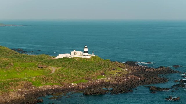 Aerial view of coastal lighthouse on rocky shore in Taiwan 