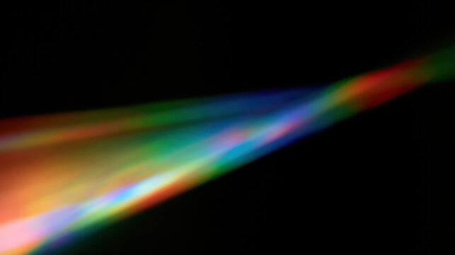 vibrant prism light leak cuts diagonally across dark backdrop creating cinematic rainbow refraction artifact