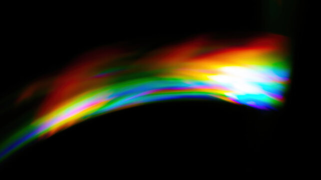vibrant prism light leak cuts diagonally across dark backdrop creating cinematic rainbow refraction artifact