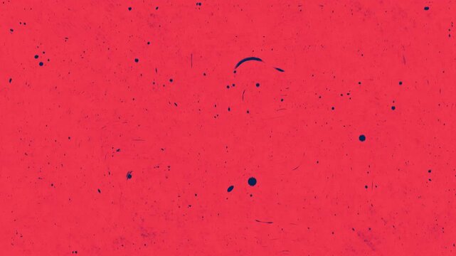 Red texture with grainy dark spots and tiny black particles. Suitable for backgrounds, overlays, and abstract design projects.