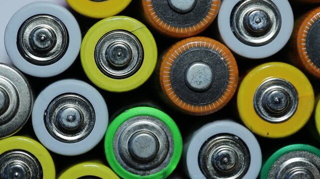 Various batteries with a top view rotating, AA batteries rechargeable batteries