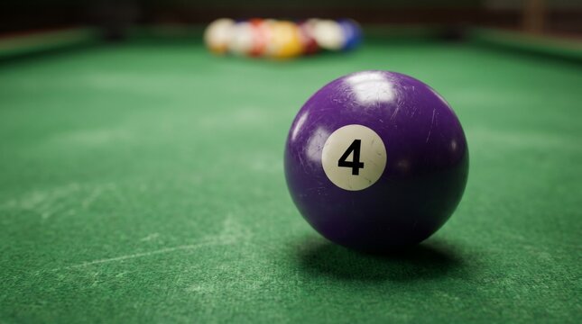 Purple Billiard Ball Number 4 on Green Felt Table with Blurred Balls in Background