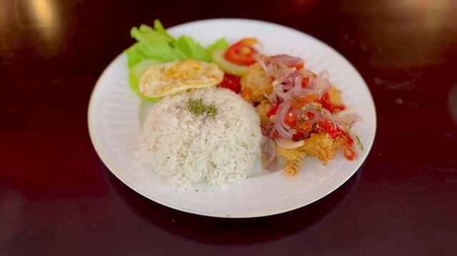 Delicious plate of rice and stir fried vegetables on a table