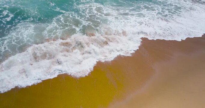 waves breaking on the beach