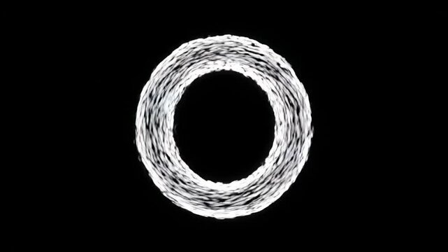 A ring of small dots forms a circle on a black background